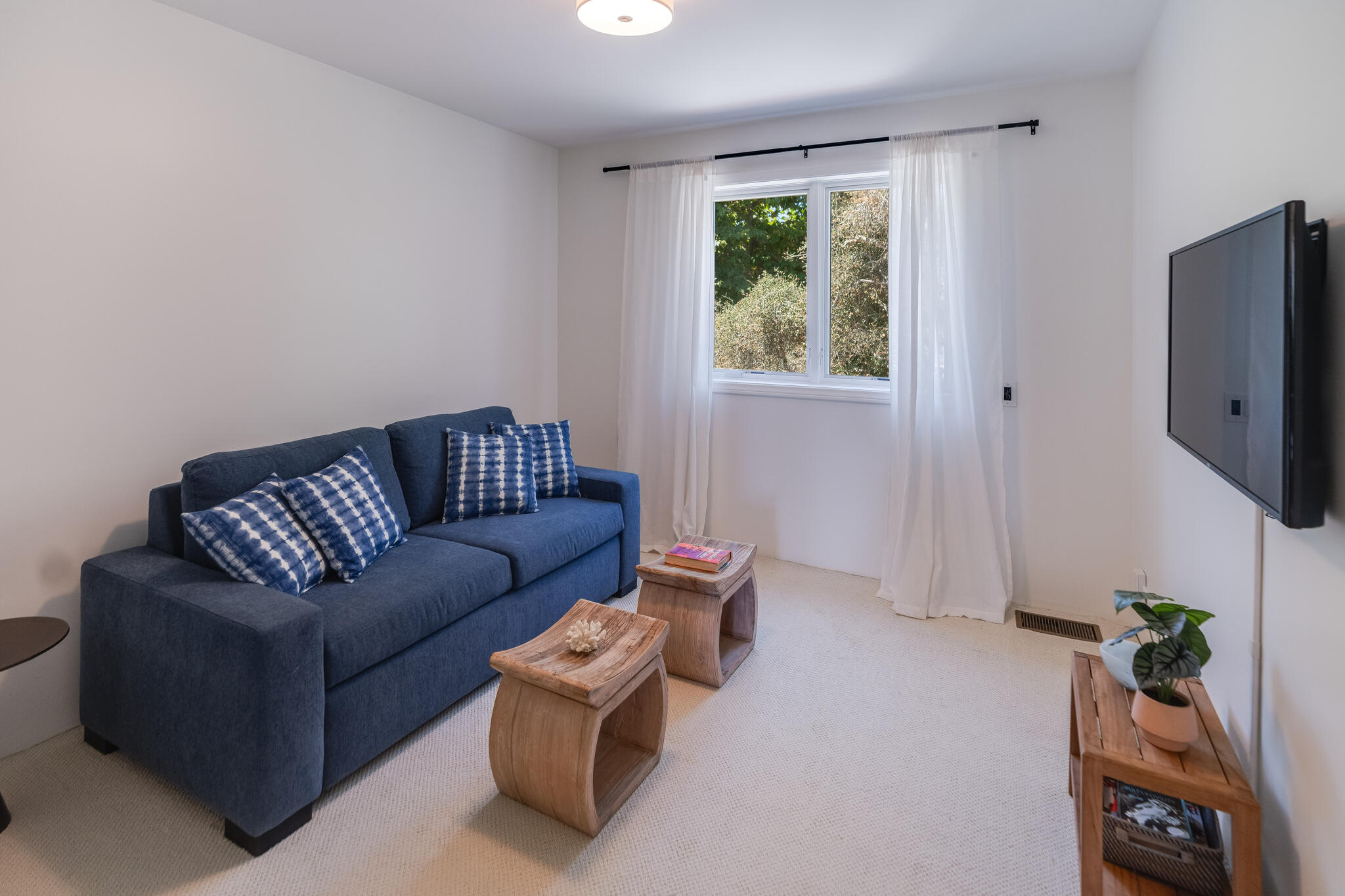 1647 Posilipo Lane, Unit B Montecito, CA 93108 - Photo 24 of 37 a living room with furniture and a flat screen tv