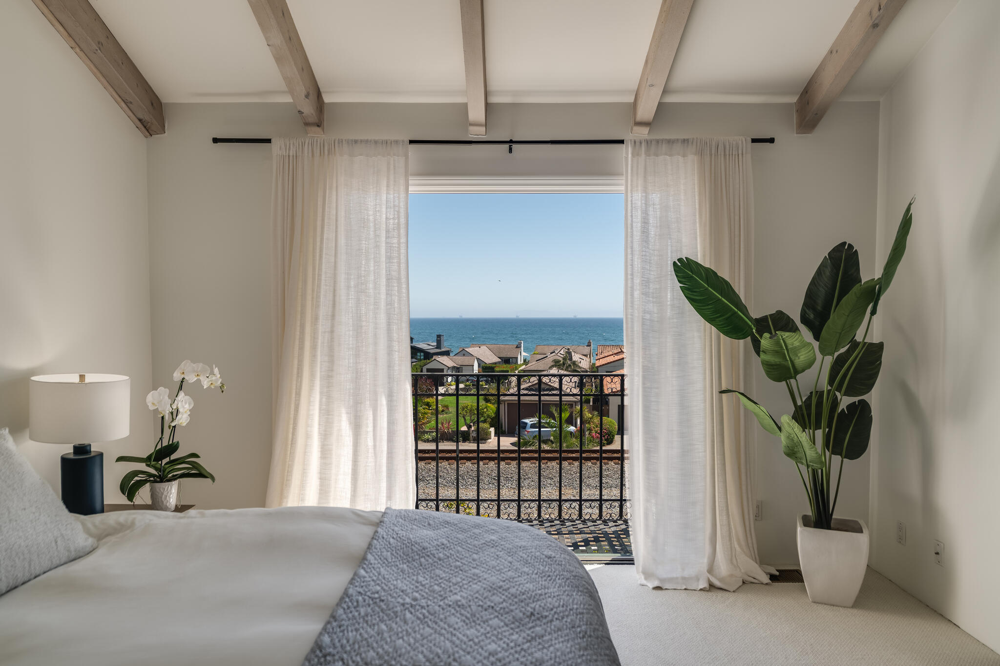 1647 Posilipo Lane, Unit B Montecito, CA 93108 - Photo 27 of 37 a bedroom with furniture and a potted plant