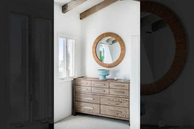 a bathroom with a granite countertop sink mirror and double