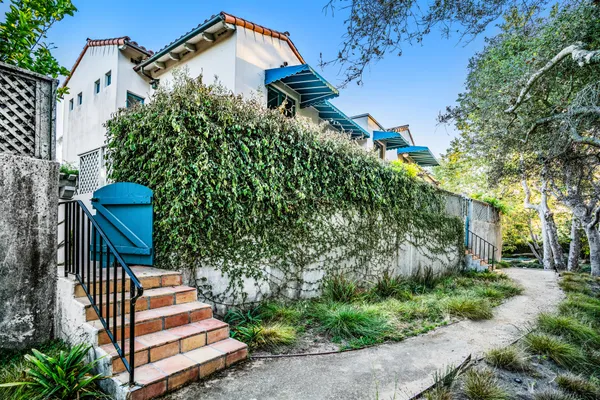 a bunch of flowers in a balcony