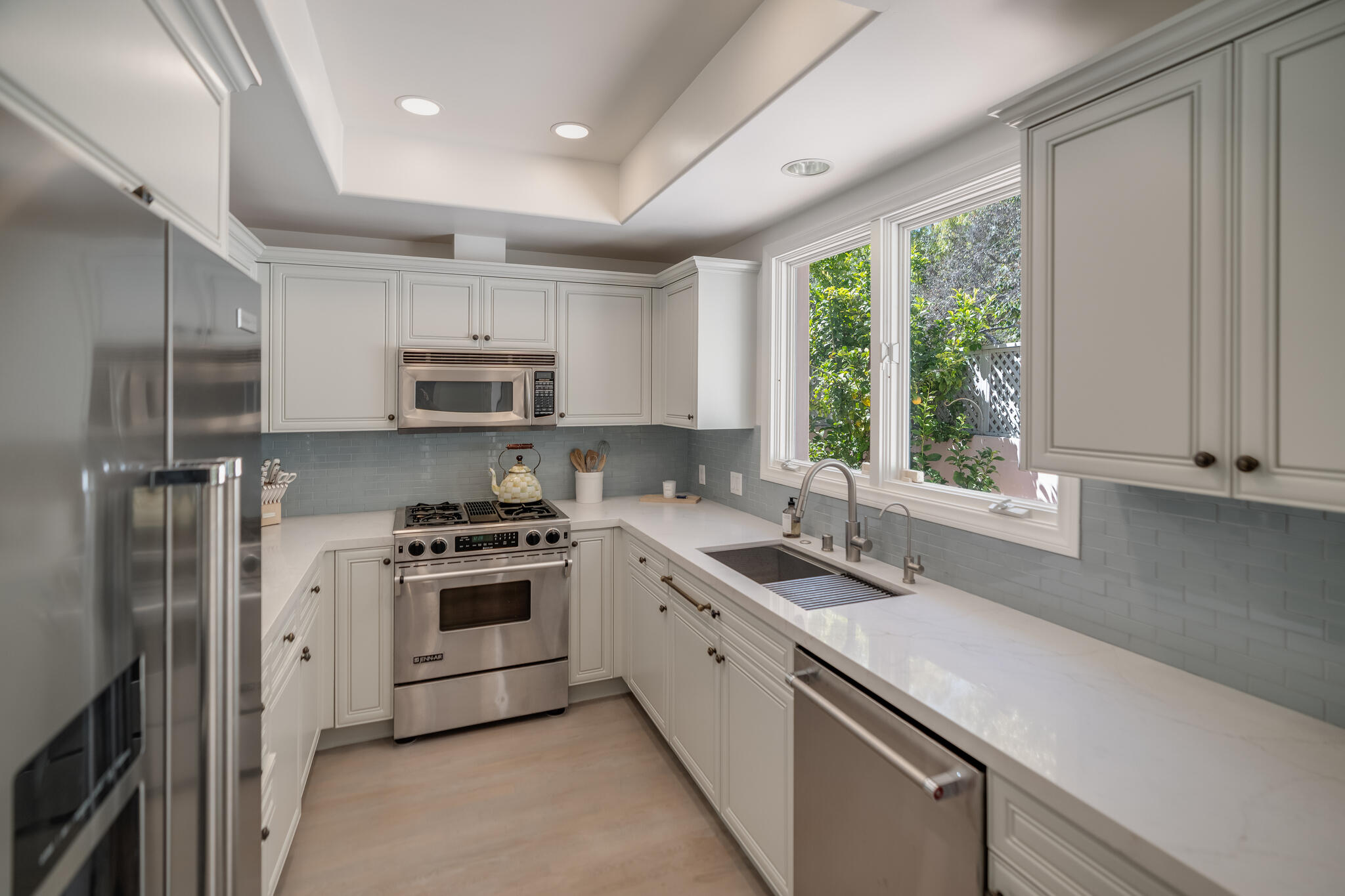 1647 Posilipo Lane, Unit B Montecito, CA 93108 - Photo 9 of 37 a kitchen with a sink stove top oven and refrigerator