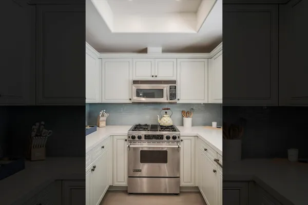 a kitchen with a stove and a microwave