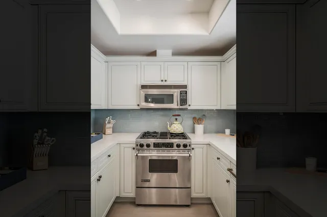 a kitchen with a stove and a microwave