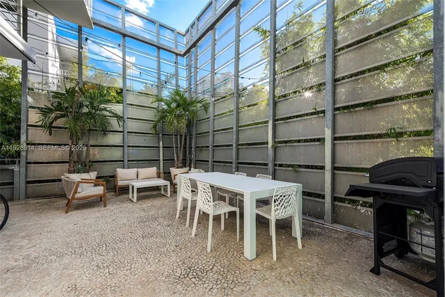 a patio with table and chairs