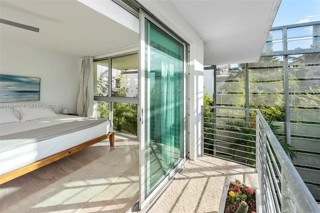 a spacious bedroom with a bed and a window