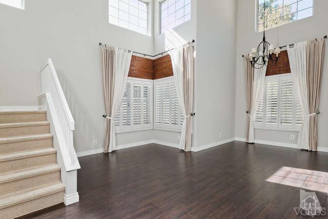 1159 Corto Street Simi Valley, CA 93065 - Photo 2 of 26 a view of walk in closet with wooden floor and stairs