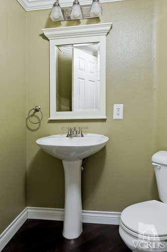 1159 Corto Street Simi Valley, CA 93065 - Photo 17 of 26 a bathroom with a sink toilet and mirror