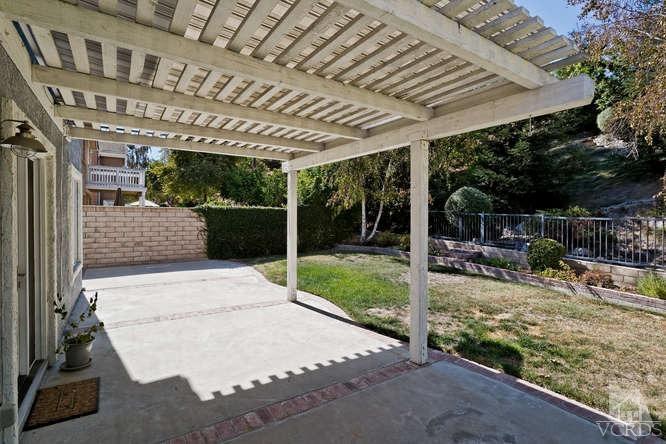 1159 Corto Street Simi Valley, CA 93065 - Photo 18 of 26 a view of house with backyard and porch