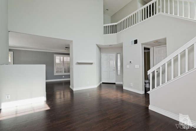 1159 Corto Street Simi Valley, CA 93065 - Photo 3 of 26 a view of an entryway with wooden floor and windows