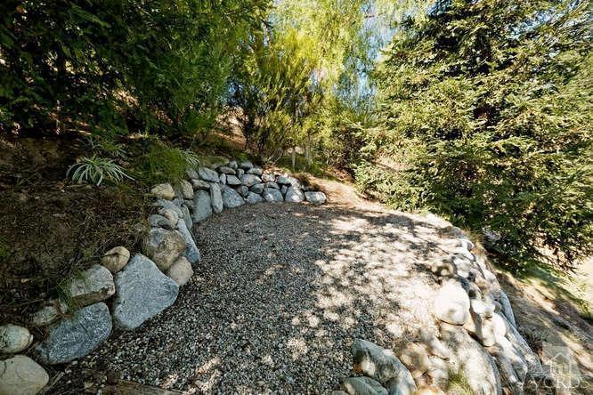 1159 Corto Street Simi Valley, CA 93065 - Photo 24 of 26 a view of a yard with plants and trees