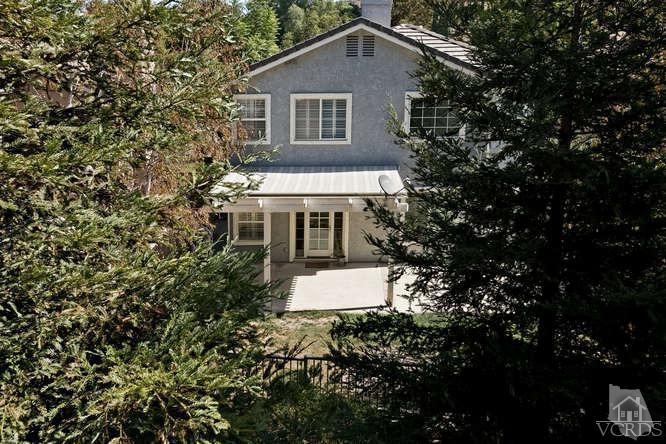 1159 Corto Street Simi Valley, CA 93065 - Photo 26 of 26 a front view of a house with a yard and garage