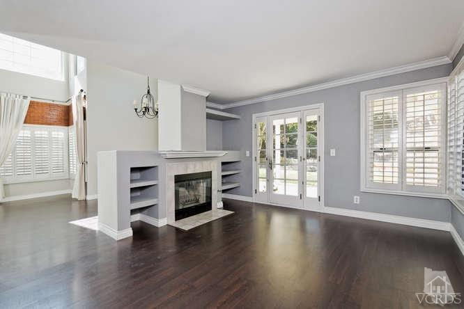 1159 Corto Street Simi Valley, CA 93065 - Photo 5 of 26 a view of an empty room with wooden floor and a window