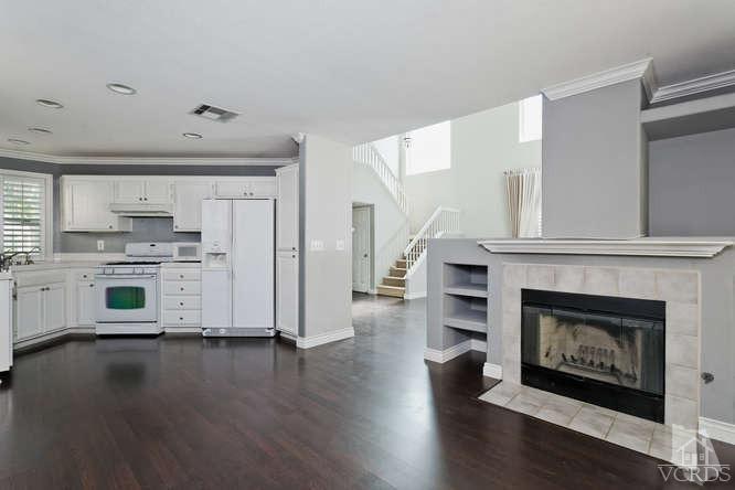1159 Corto Street Simi Valley, CA 93065 - Photo 6 of 26 a view of kitchen with microwave and wooden floor