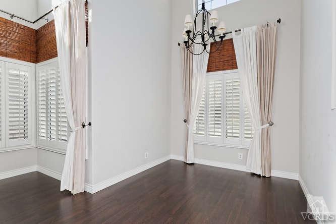 1159 Corto Street Simi Valley, CA 93065 - Photo 7 of 26 a view of a room with wooden floor and windows