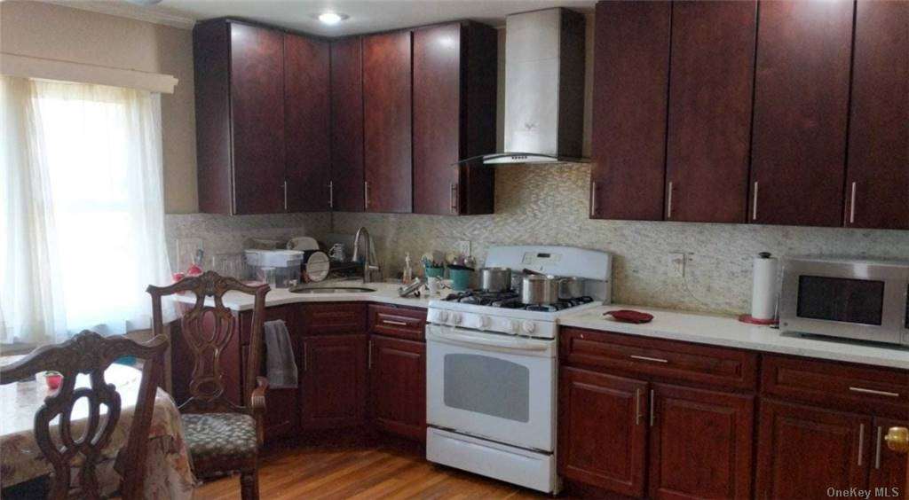 a kitchen with a sink cabinets and appliances