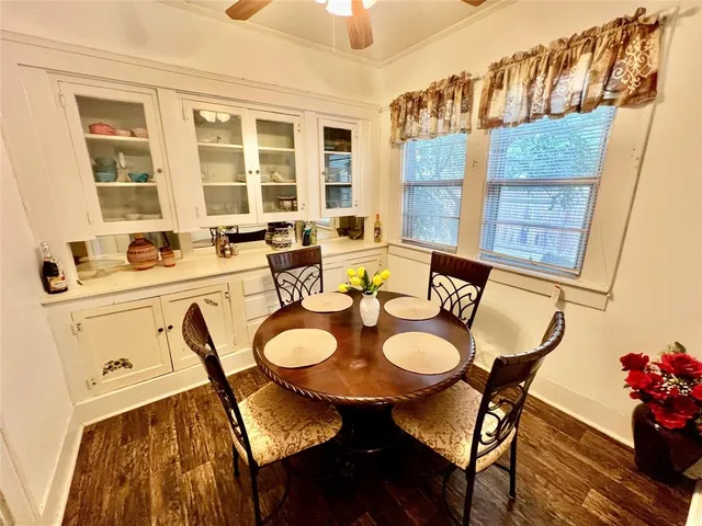a dining room with furniture and window