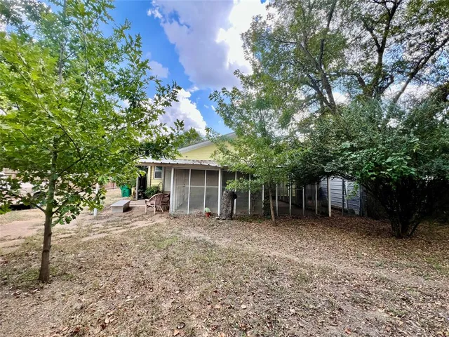 front view of a house with a trees