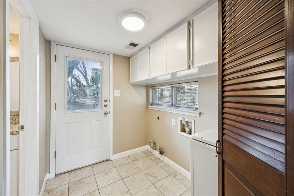 2017 Durham Street Irving, TX 75062 - Photo 11 of 26 a view of a hallway to rooms and stairs
