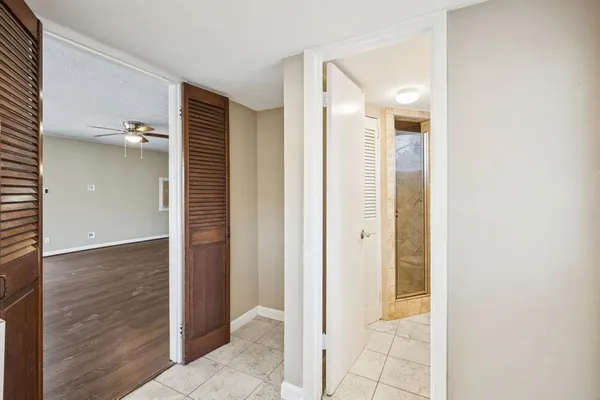 a view of a bathroom with a shower and a sink
