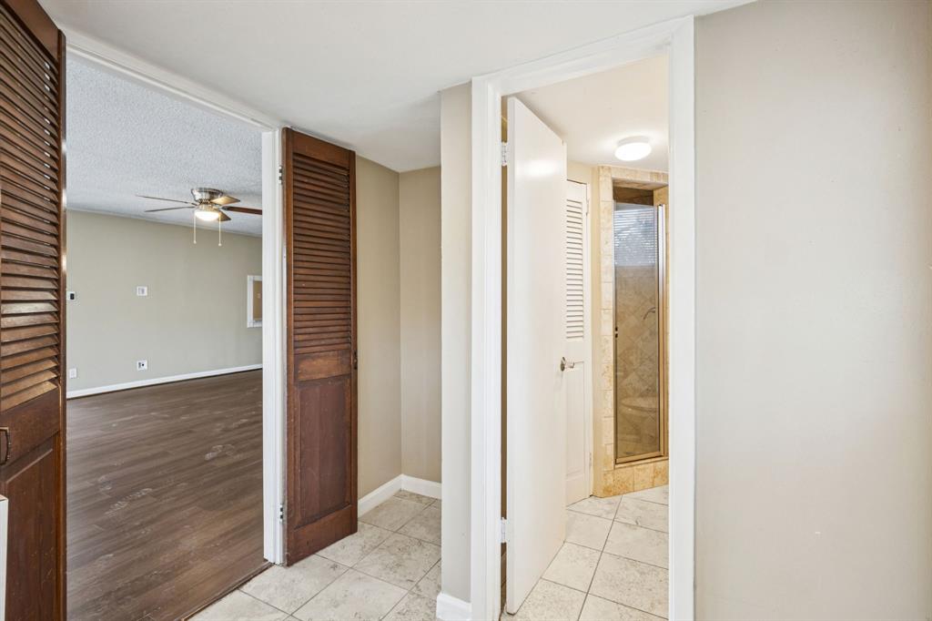 2017 Durham Street Irving, TX 75062 - Photo 12 of 26 a view of a bathroom with a shower and a sink