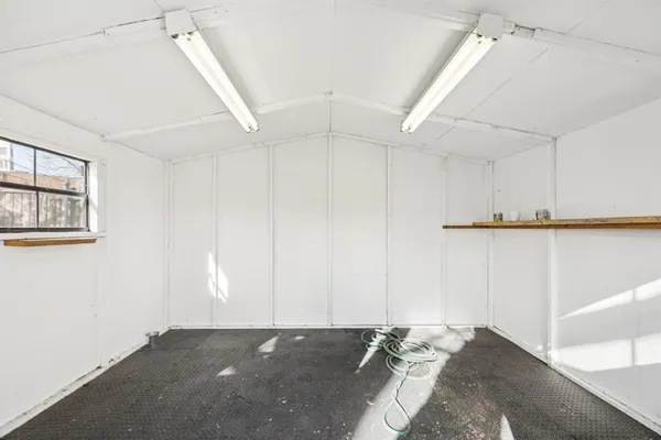 a view of an empty room with windows