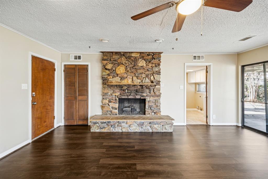 2017 Durham Street Irving, TX 75062 - Photo 21 of 26 a living room with furniture and a fireplace