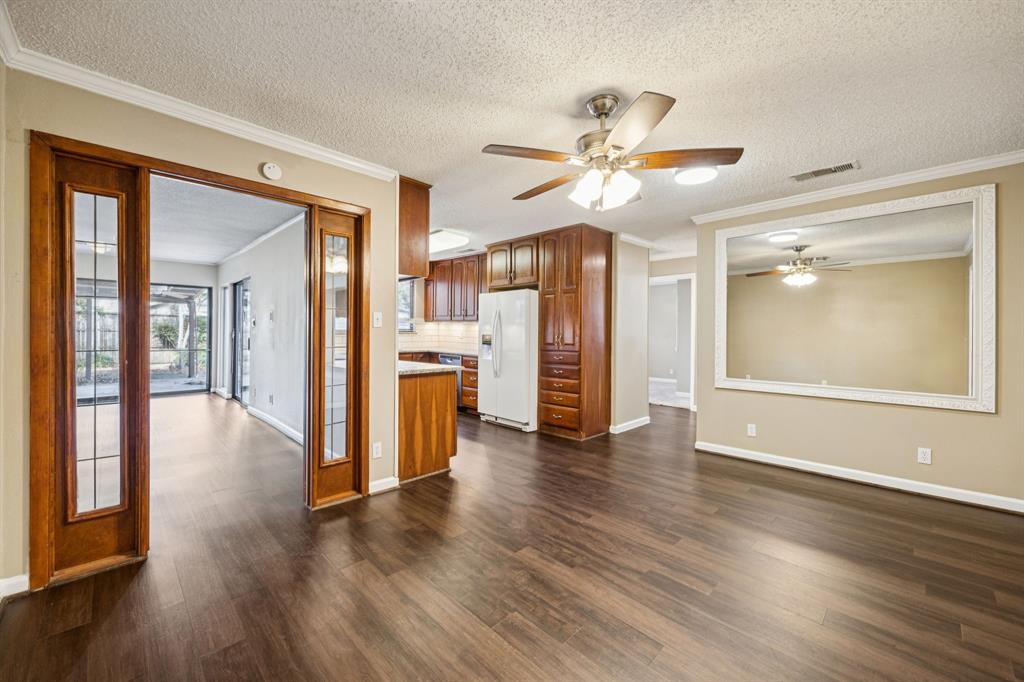 2017 Durham Street Irving, TX 75062 - Photo 4 of 26 a view of an empty room with window and wooden floor