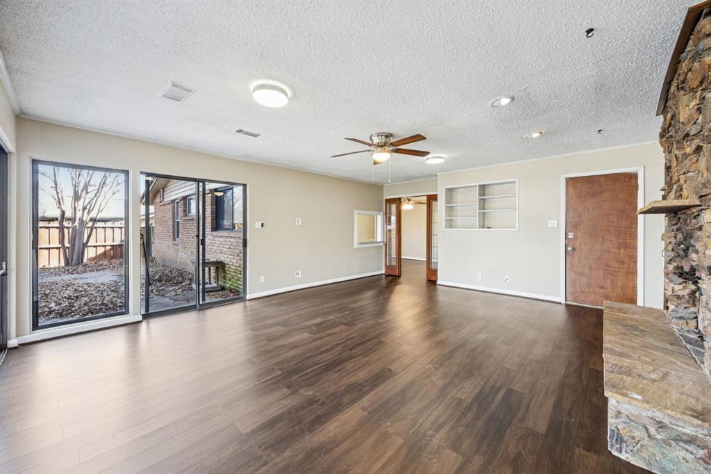 2017 Durham Street Irving, TX 75062 - Photo 10 of 26 a view of an empty room with wooden floor and a window