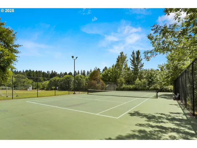 a view of an outdoor space and tennis court