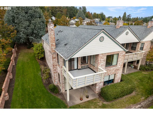 an aerial view of a house with a garden