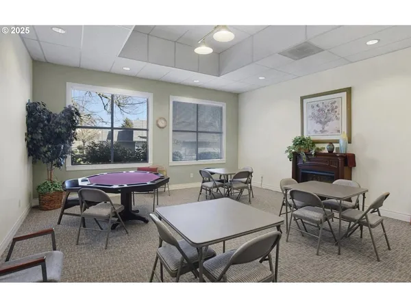 a dining room with furniture and a book shelf
