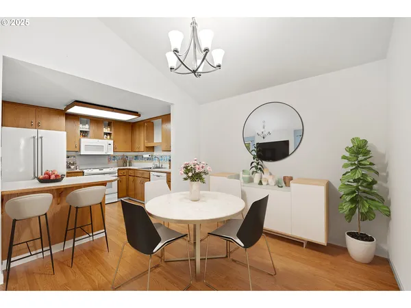 a dining room with furniture and chandelier