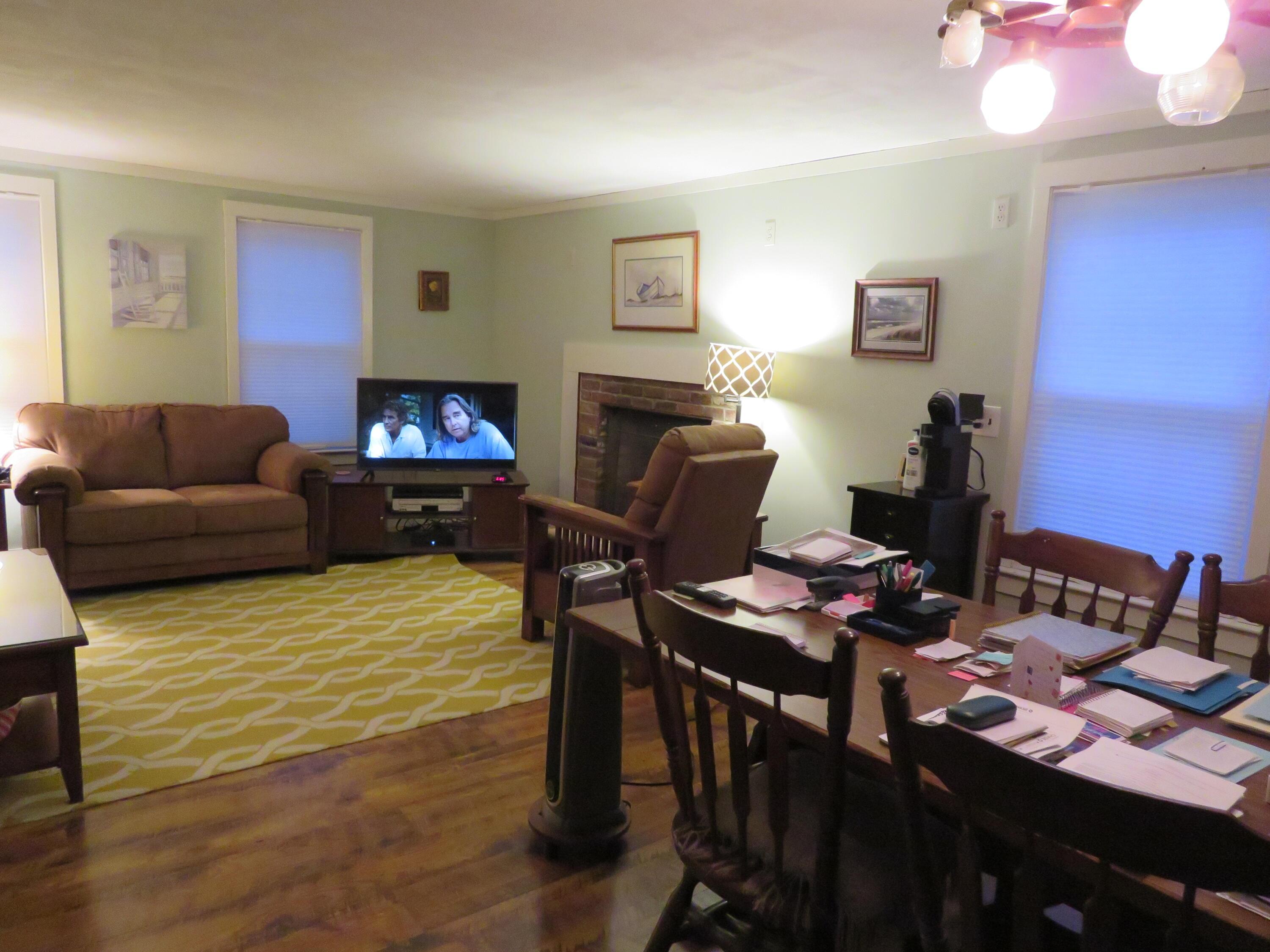 65 Clayton Road Eastham, MA 02642 - Photo 4 of 12 a living room with furniture and a fireplace