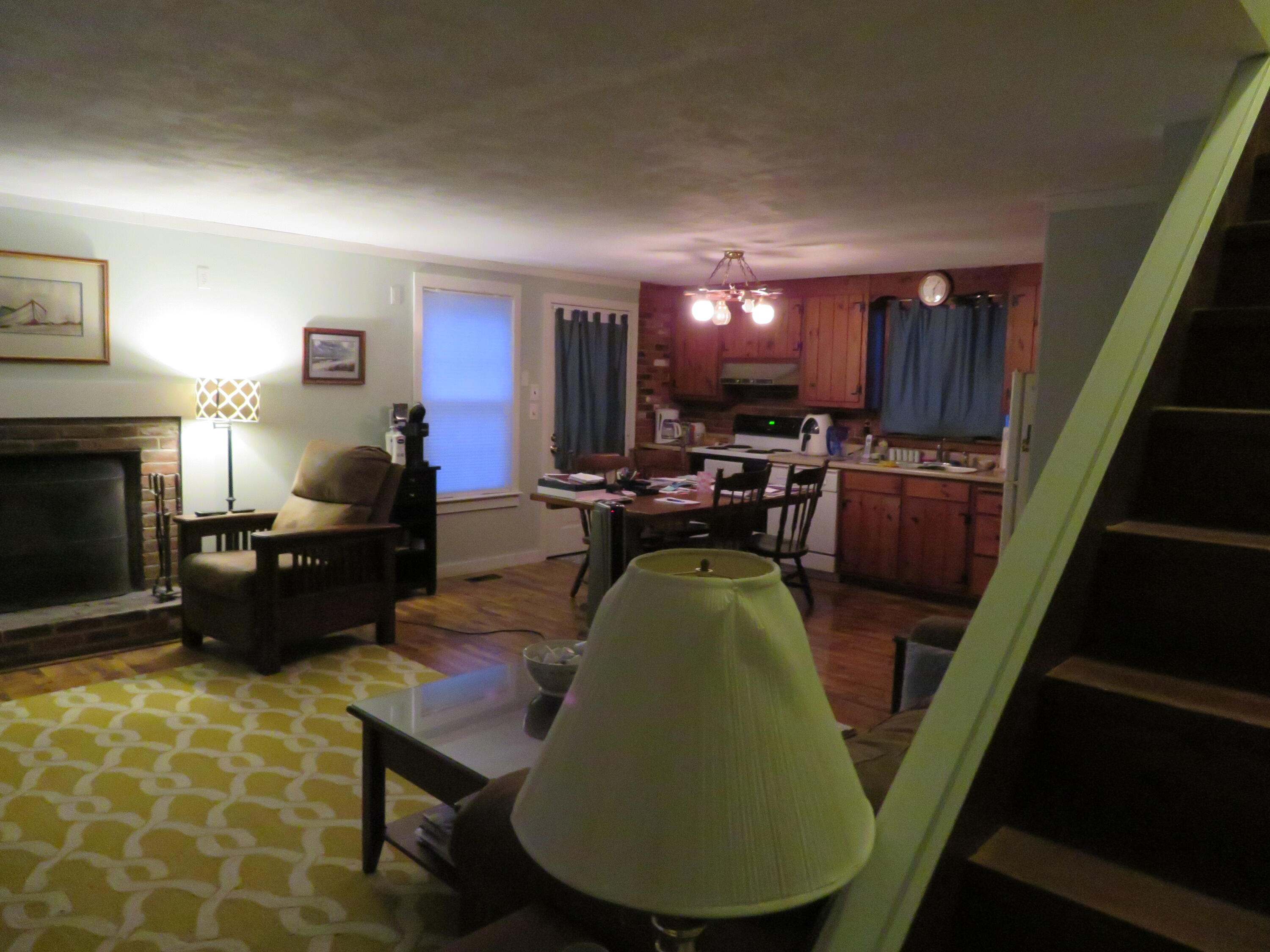 65 Clayton Road Eastham, MA 02642 - Photo 5 of 12 a living room with furniture and a fireplace