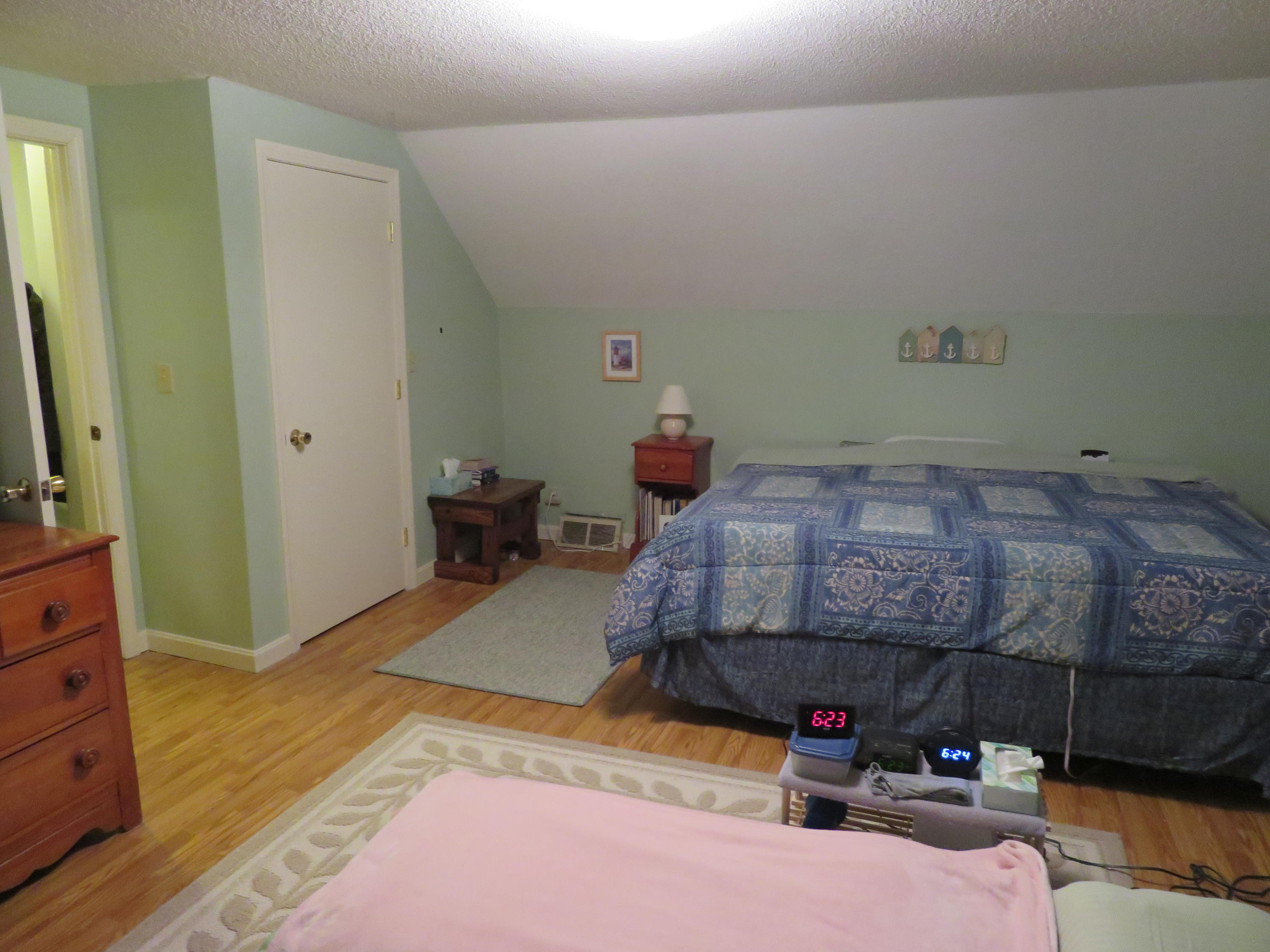 65 Clayton Road Eastham, MA 02642 - Photo 7 of 12 a bedroom with a bed and a tv in it