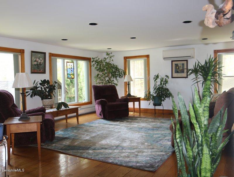 37 Russell Road Huntington, MA 01050 - Photo 12 of 22 a living room with furniture potted plant floor and a large window