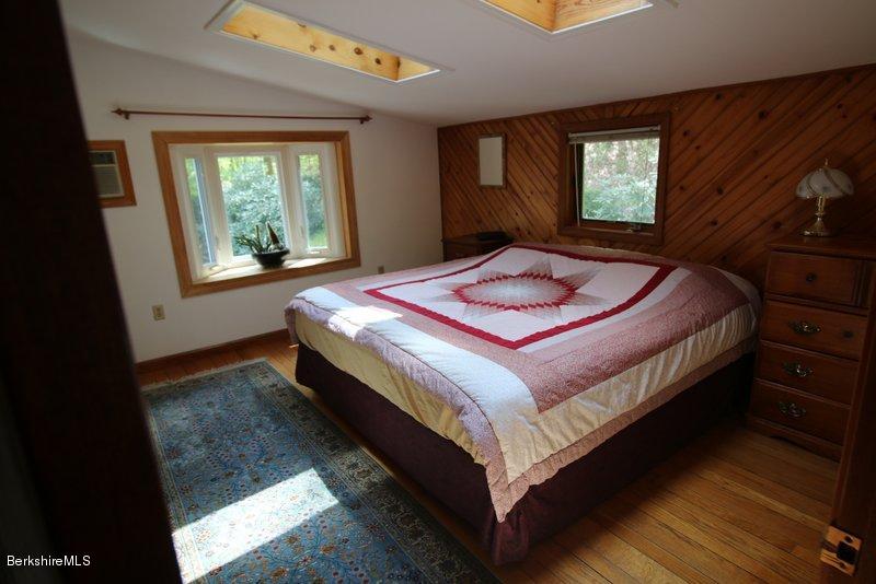 37 Russell Road Huntington, MA 01050 - Photo 17 of 22 a bed sitting in a bedroom next to a window