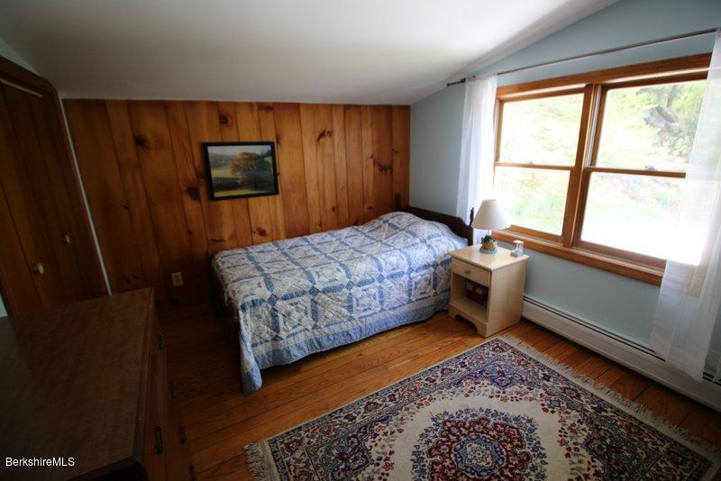 37 Russell Road Huntington, MA 01050 - Photo 19 of 22 a bedroom with a bed next to a window