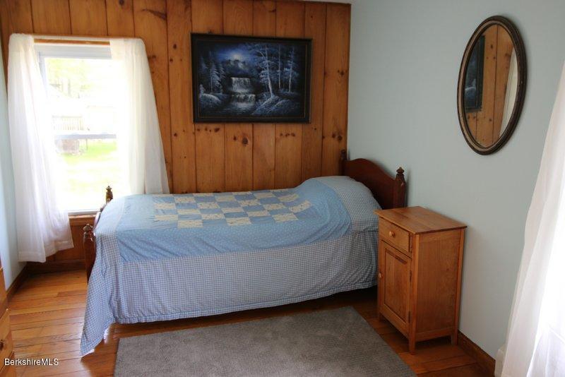 37 Russell Road Huntington, MA 01050 - Photo 20 of 22 a bedroom with a bed and a painting on the wall