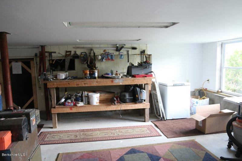 37 Russell Road Huntington, MA 01050 - Photo 21 of 22 a living room with furniture and a flat screen tv