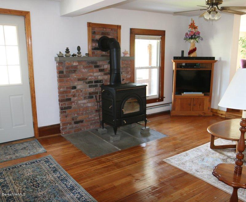 37 Russell Road Huntington, MA 01050 - Photo 6 of 22 a living room with furniture and a fireplace