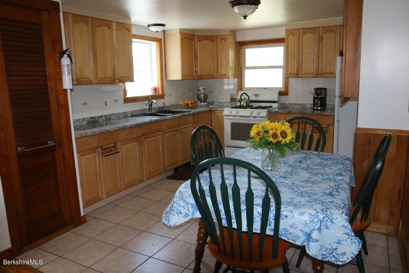37 Russell Road Huntington, MA 01050 - Photo 9 of 22 a kitchen with granite countertop a sink a window appliances and cabinets