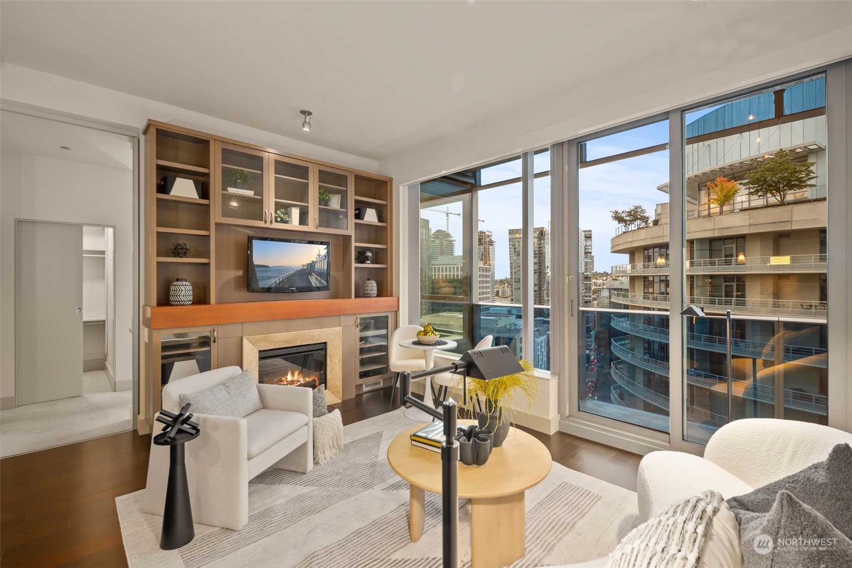 737 Olive Way, Unit 2503 Seattle, WA 98101 - Photo 1 of 29 a living room with furniture and a floor to ceiling window