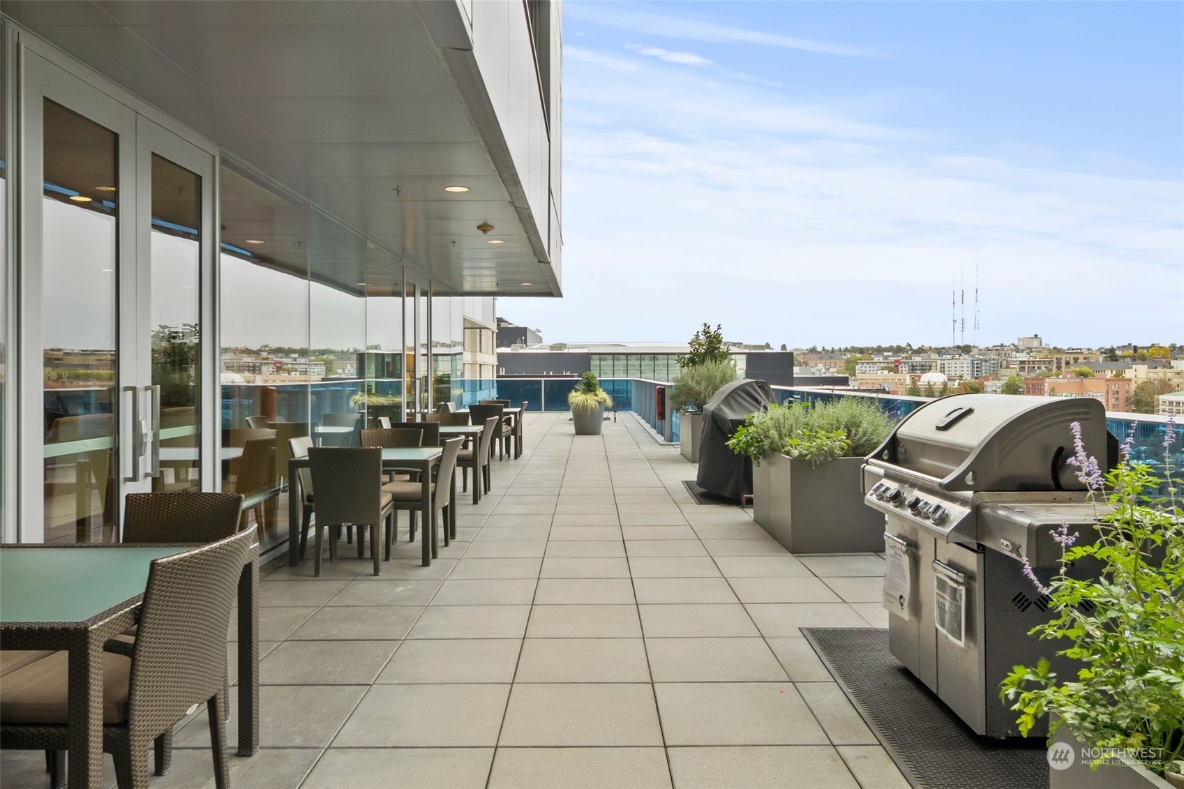 737 Olive Way, Unit 2503 Seattle, WA 98101 - Photo 18 of 29 a view of a terrace with furniture and garden