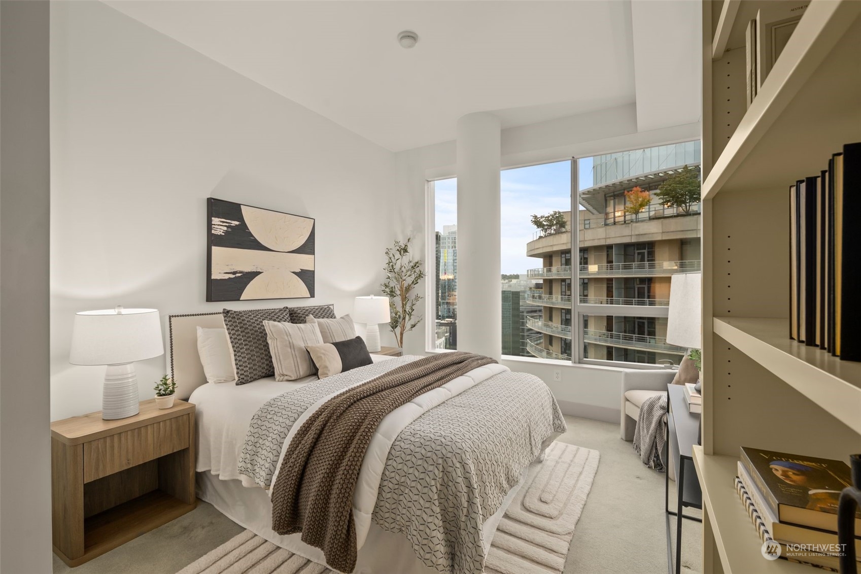 737 Olive Way, Unit 2503 Seattle, WA 98101 - Photo 2 of 29 a bedroom with a large bed and a window