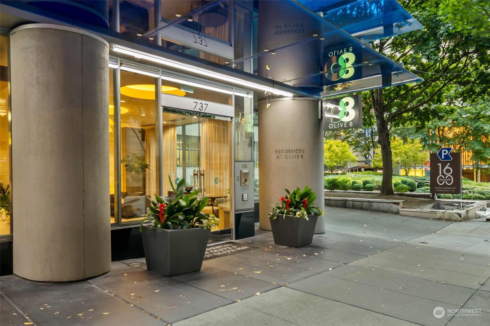 737 Olive Way, Unit 2503 Seattle, WA 98101 - Photo 24 of 29 a building outdoor space with potted plants