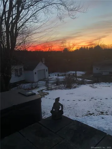 a view of a backyard of the house