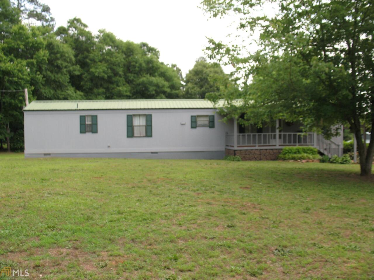 111 Hanley Road Royston, GA 30662 - Photo 1 of 1 a view of a house with a backyard