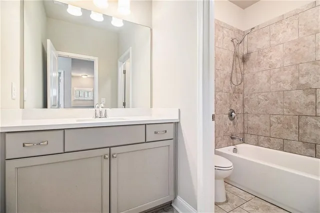 a view of a house with backyard and a patio