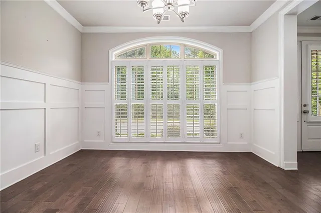 a bathroom with a sink a vanity a large mirror and a window